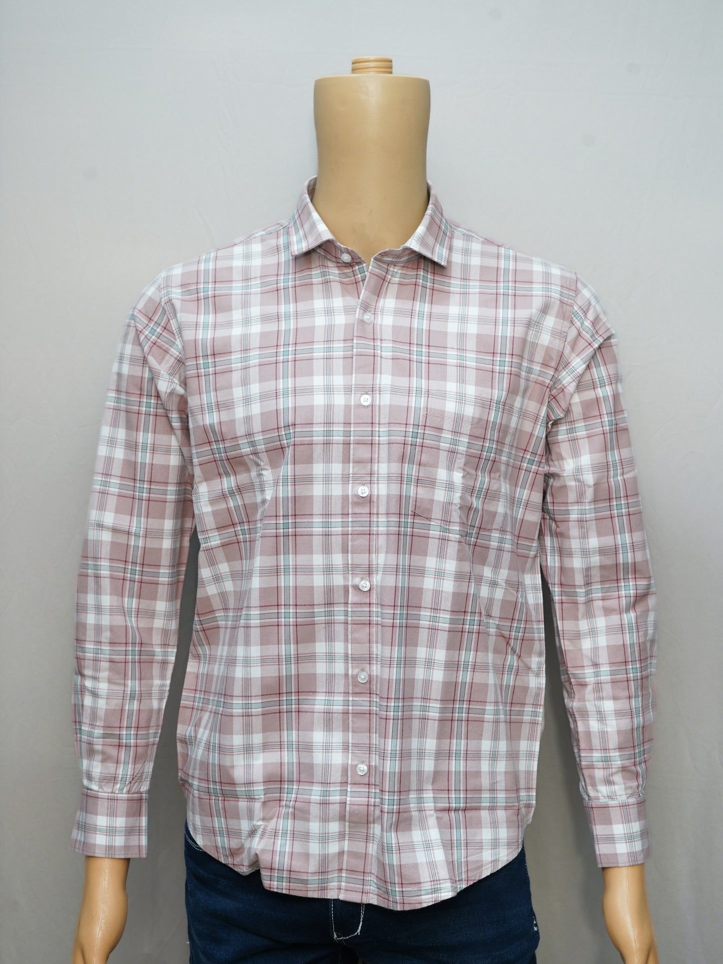 Full view of a blush pink check men's shirt styled on a mannequin, featuring a soft and elegant design.