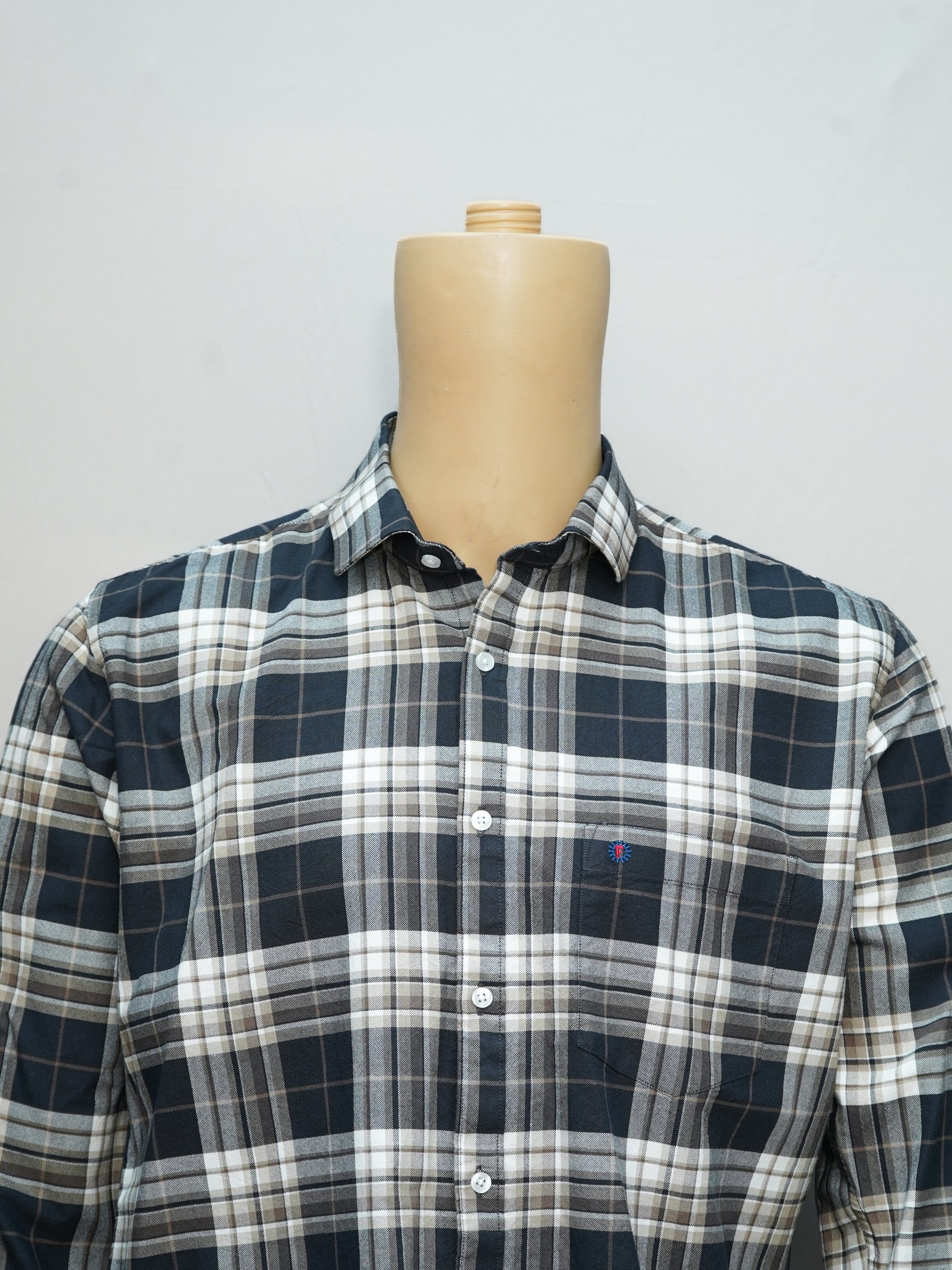 Close-up of a midnight plaid check men's shirt, showcasing its black and taupe tones with a classic plaid design.