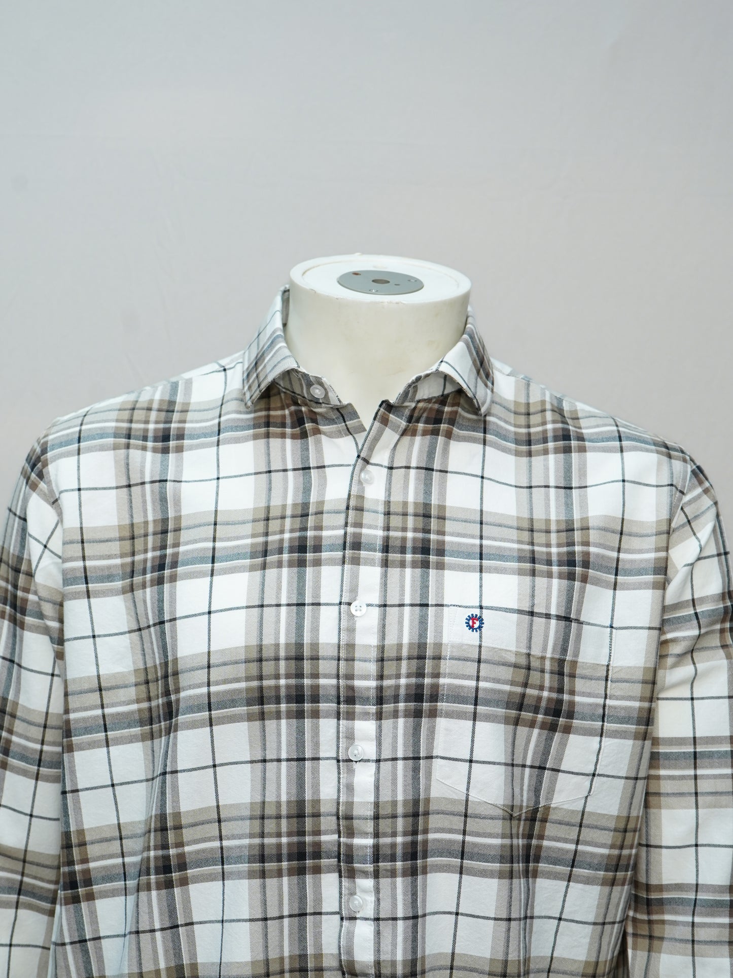 Close-up of an ivory sand check men's shirt, highlighting its soft beige tones and classic design.