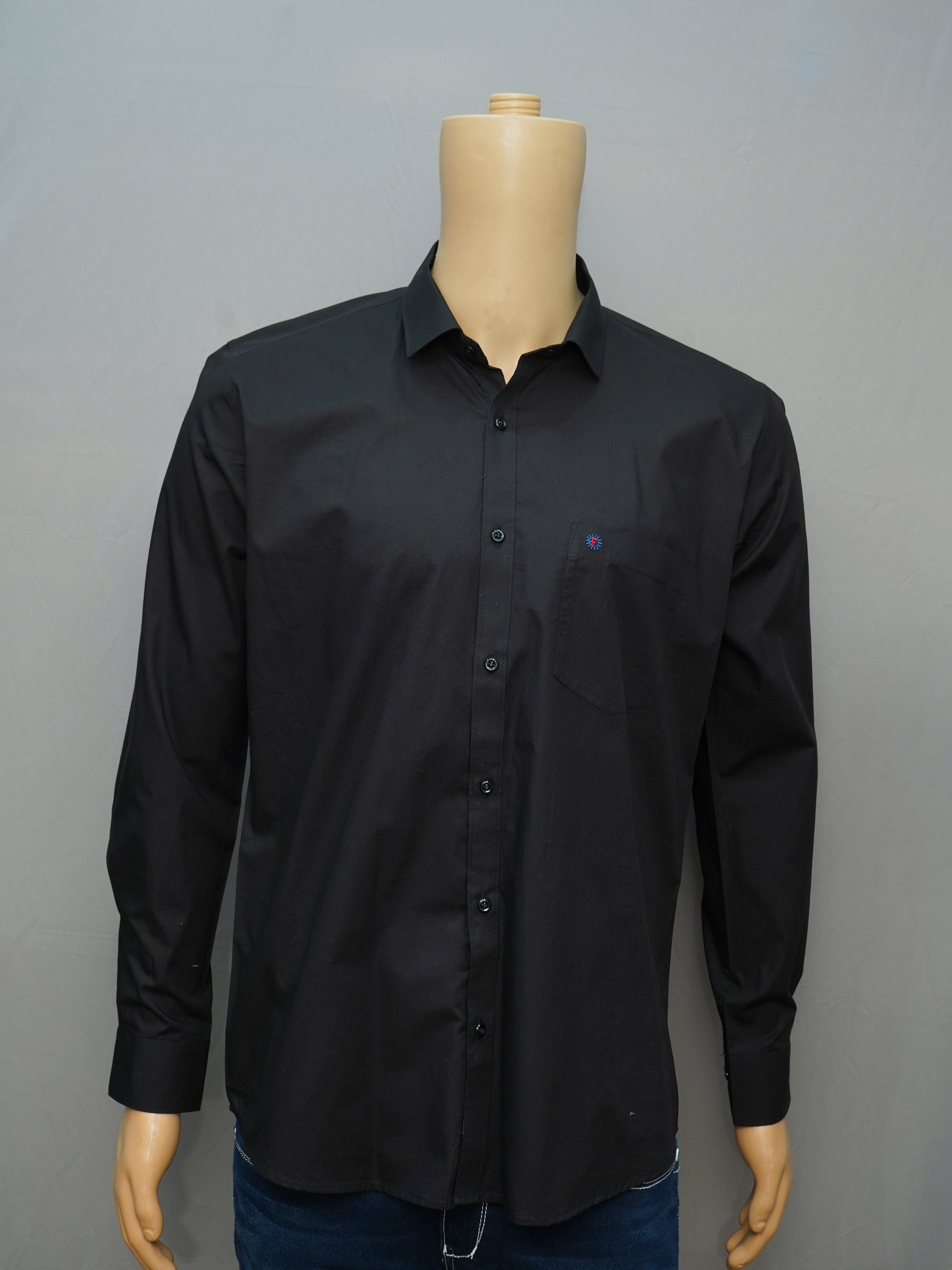 Full view of a jet black formal men's shirt styled on a mannequin, showcasing a sleek and elegant design.