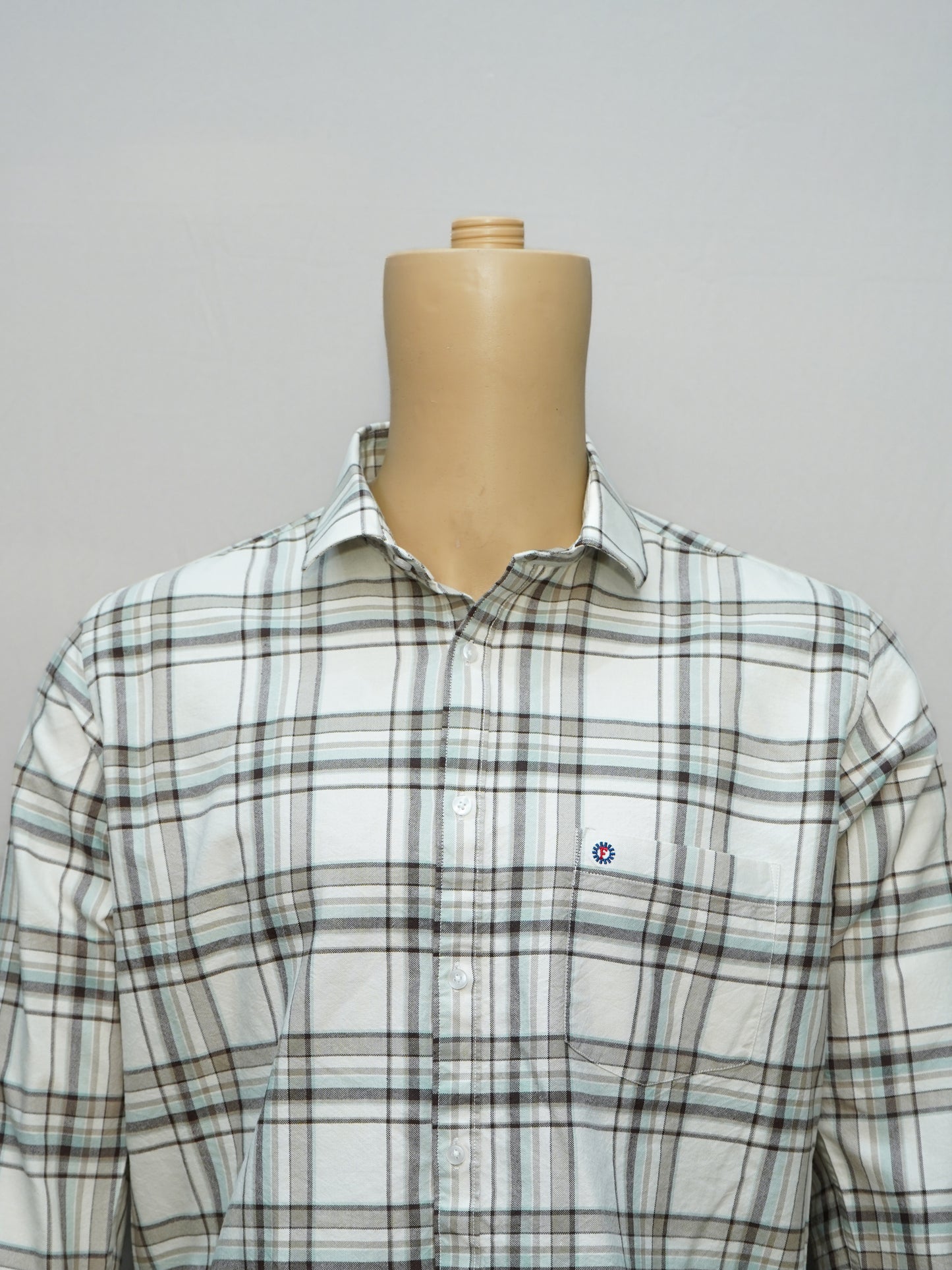 Close-up of Off-White Check Shirt showcasing check patterns and details.