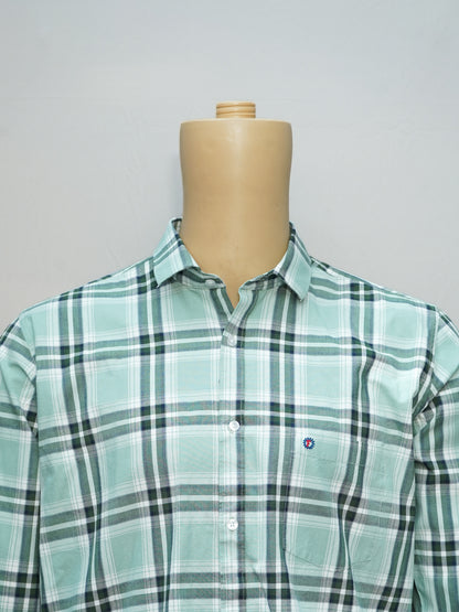 Close-up of mint green checked shirt with detailed checkered pattern.