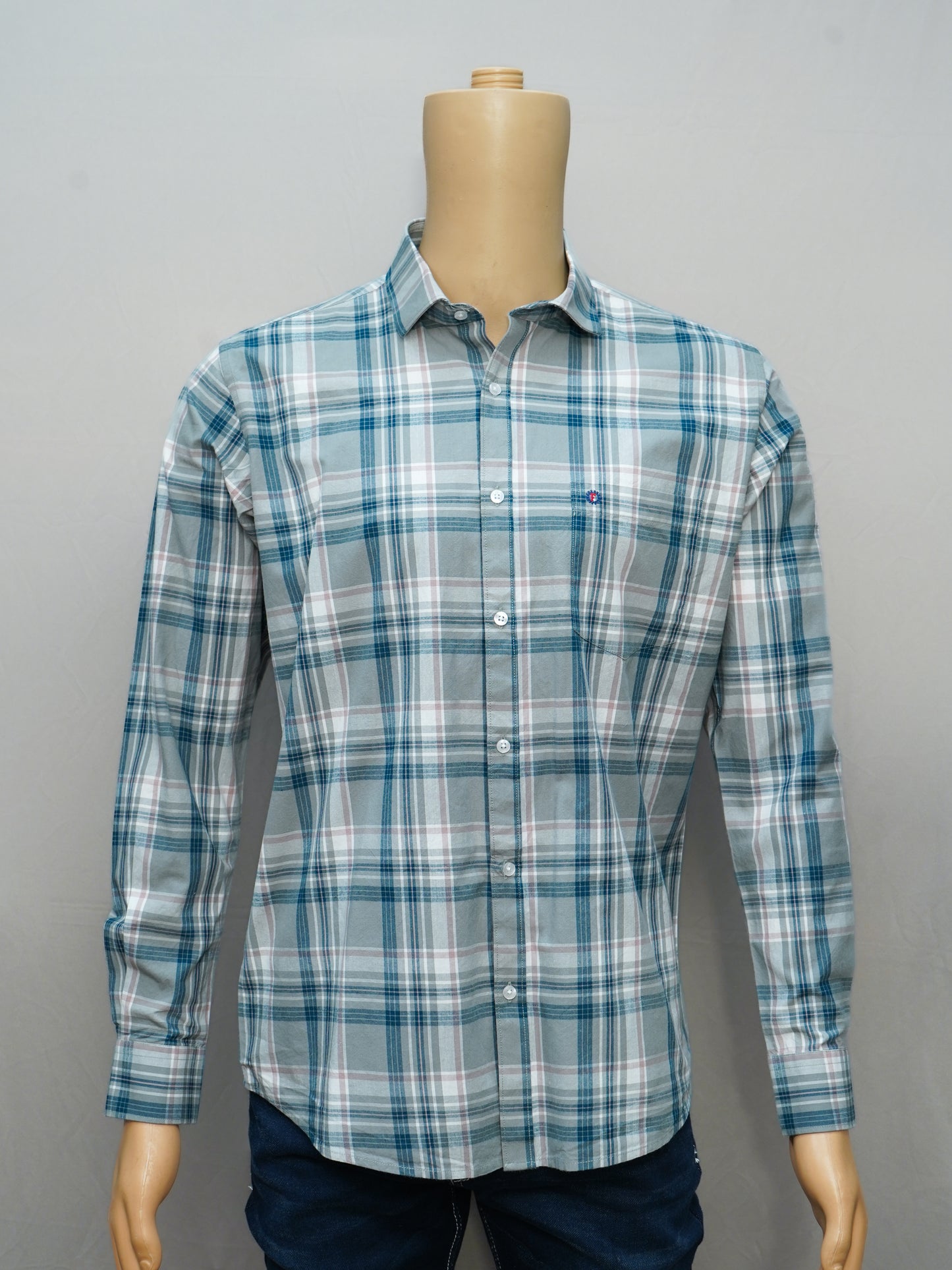 Teal and white check cotton shirt with a sleek design.